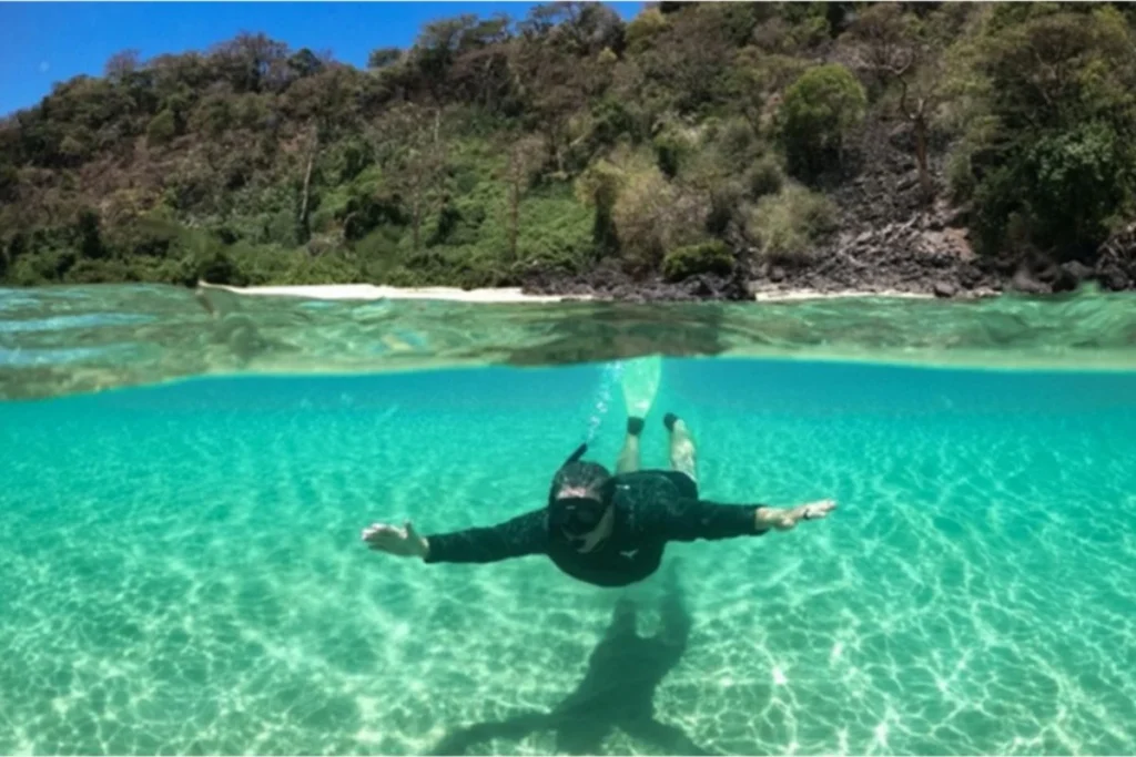 Aerial view of Baía do Sancho with turquoise waters and cliffs – snorkeling paradise in Northeast Brazil