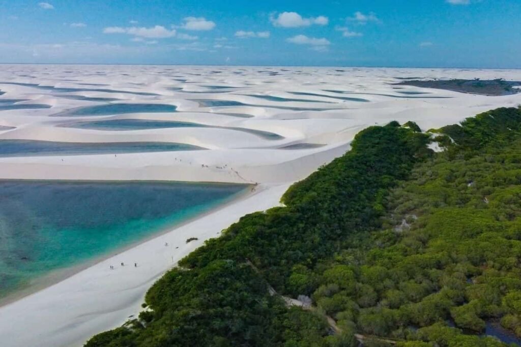 Sand dunes and crystal-clear lagoons in Lençóis Maranhenses, a stunning natural wonder and one of the best places to visit in Brazil this summer