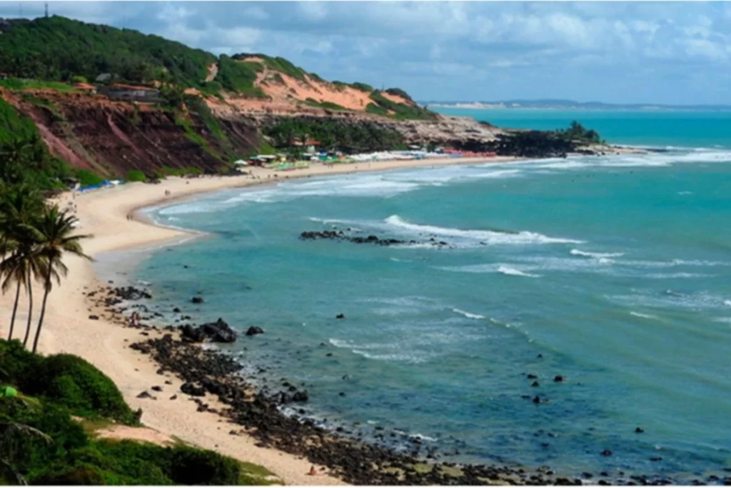 Cliffs and ocean waves at Praia de Pipa – surfing hotspot in Northeast Brazil