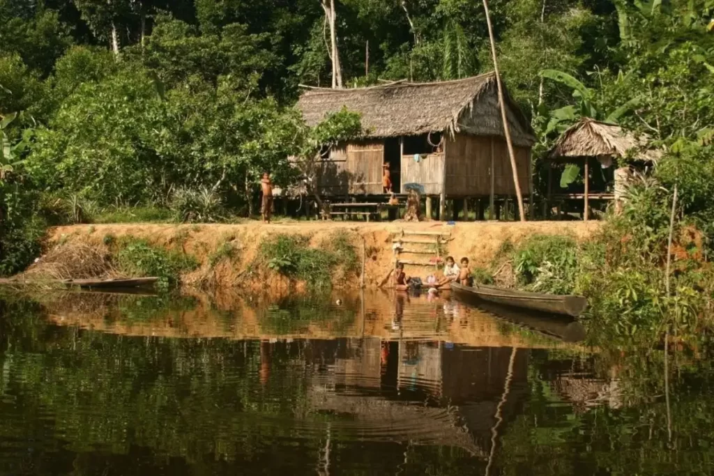 Traditional riverside village of Amazonian locals along the riverbank