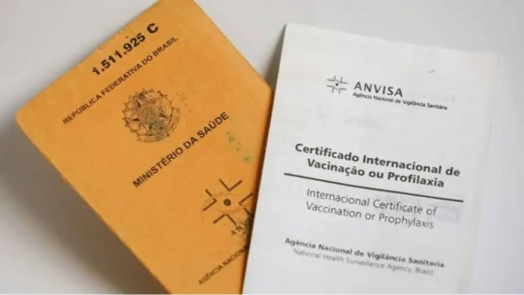 Yellow fever vaccination certificates and healthcare documents on a surface, ready for travel verification.
