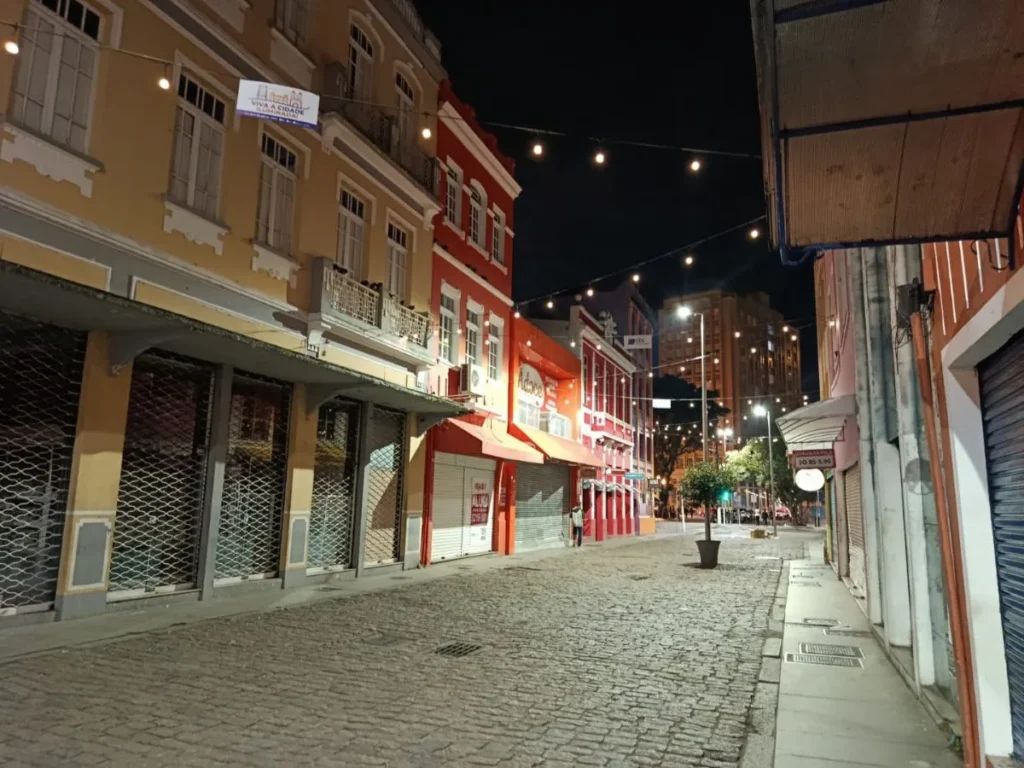 Historic street in Florianópolis centro histórico at night, colonial facades and string lights